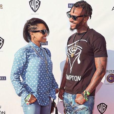 Kyla Pratt her fiance Danny Kilpatrick smiling at each other